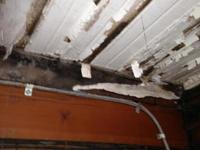Closeup of water damage on captain's cabin ceiling